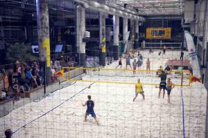 a group of people playing a game of volleyball at Brand new modern condo built-in Mall of Tripla in Helsinki