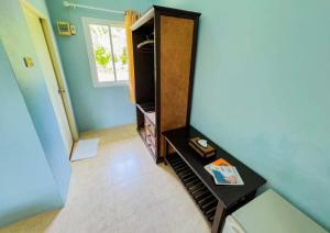 a room with a dresser and a mirror at Waterjade Resort in Phangnga