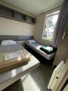 Galeriebild der Unterkunft Le G9 - Bungalow lumineux pour 4 avec TV in Boofzheim