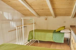 a room with a bunk bed and a staircase at nonnanina in Pisticci