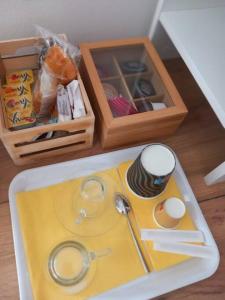 a toy table with a tray with a spoon and a cup at Vito's Room in Cormano