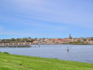 a large body of water with a town in the background at Bell Tower in Berwick-Upon-Tweed