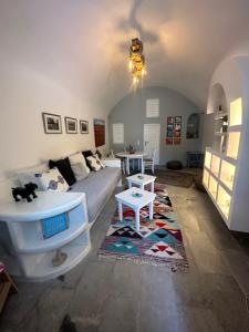 a living room with a couch and a table at Kefia 1 in Mesaria