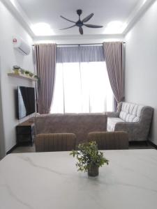 a living room with a couch and a table at Sakinah Homestay P5 Putrajaya in Putrajaya