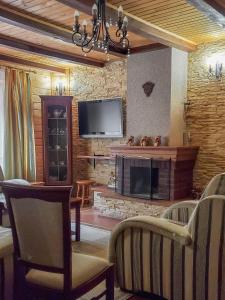 TV a/nebo společenská místnost v ubytování Elf-cottage