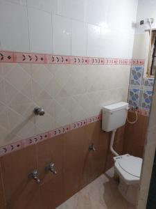 Ett badrum på Ram Nivas Home Stay Dwarka