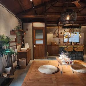 a large living room with a table and a fireplace at Jeju Deluang Gimnyeong 1236 in Jeju