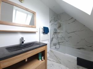 a bathroom with a sink and a shower at Bonheur dans le Finistère cosy jardin 2-8 pers in Névez +32 photos