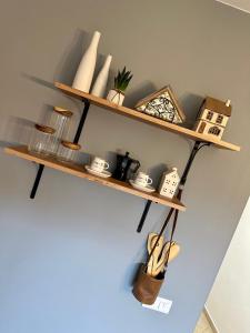 a shelf on the wall with various items on it at Apartmán MATEO Donovaly in Donovaly