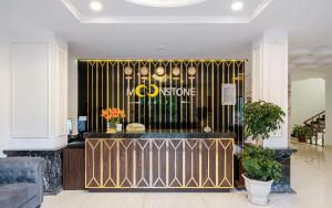 a store front with a gold and black screen at TTR Moonstone Apart Hotel in Da Lat