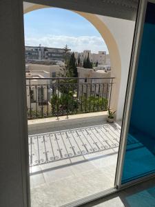 a balcony with a view of a city at Lac 2 apartement in Tunis