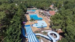 an aerial view of a water park with a pool at Le Bois Dormant in Saint-Jean-de-Monts +8 photos