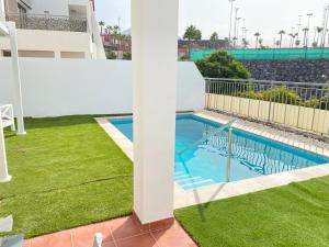 a view of the pool from the balcony of a apartment at OH LA LIFE! MAGNOLIA GOLF SUSANA in Adeje