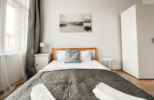 Postel nebo postele na pokoji v ubytování ELSO apartments