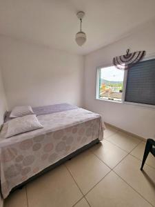 Postel nebo postele na pokoji v ubytování Apartamento pé na areia no centro de Bertioga