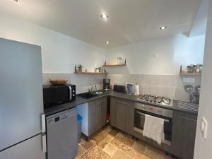 Kuchyň nebo kuchyňský kout v ubytování L Appart