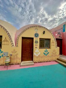 a building with a pool in front of it at Horus Mini Resort in Cairo