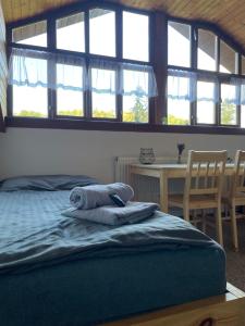 Letto o letti in una camera di Hvězdonice Hostinec U Kuželků