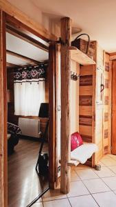 a room with a bunk bed in a cabin at Le Banc Des Seilles in Bonvillard