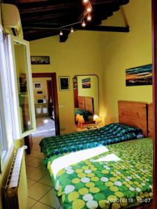 a bedroom with two beds in a room with a window at Apt bright, quiet! In the center. in Florence