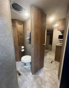 a bathroom with a toilet in a room at Sunrise Hideaway in Crystal River