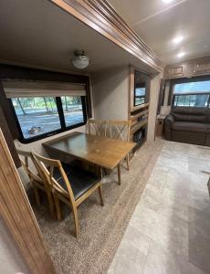 a dining room with a table and chairs in an rv at Sunrise Hideaway in Crystal River