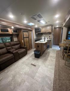 a large living room with a couch and a kitchen at Sunrise Hideaway in Crystal River