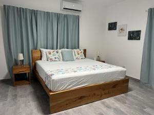 מיטה או מיטות בחדר ב-Apartamento Carey