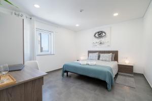 Uma cama ou camas num quarto em Host Wise Arvore