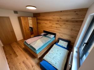 Postel nebo postele na pokoji v ubytování Apartmán Ski & Bike - Protěž