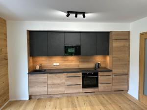 Kuchyň nebo kuchyňský kout v ubytování Apartmán Ski & Bike - Protěž