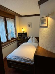 Postel nebo postele na pokoji v ubytování Hotel Astoria