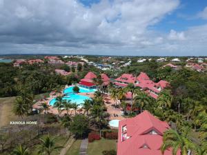 an aerial view of a resort with a swimming pool at KANOLA Home in Sainte-Anne