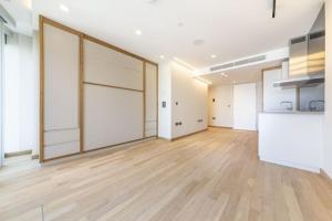 a large room with wooden floors and white walls at Manhattan Loft Gardens, Stratford in London