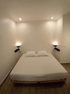 Postel nebo postele na pokoji v ubytování 11 Rue Vauban
