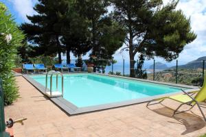 a swimming pool with a view of the mountains at Villa Eleanto in Cefalù