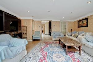 a living room with two couches and a table at Noel Road in London