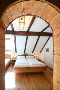 a bedroom with a large bed in an attic at Auerhof in Schladming