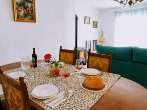 a dining room table with a turkey on top of it at El almendro de Maruja in Torviscón