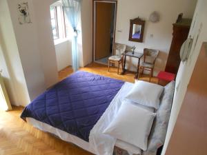Łóżko lub łóżka w pokoju w obiekcie Guesthouse Kuća na šterne