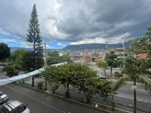a view of a street with trees and a city at Medellin Tu hogar en la eterna primavera in Medellín