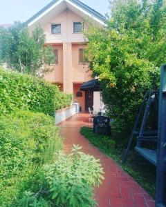 A garden outside La Casa Blu- Forum di Assago, Ospedale Humanitas, Milanofiori, IEO