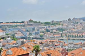 a view of a city with a river and buildings at PipaD'oro by YoursPorto in Porto