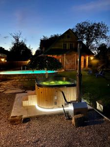 a swimming pool in a yard at night at Zacisze Pod Lipą in Andrychów