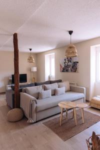 a living room with a couch and a table at La Finca de Aurora in San Rafael