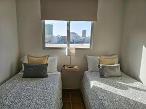 A bed or beds in a room at El ático de Concha
