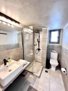 a bathroom with a sink and a shower and a toilet at Peaceful 3 Bedroom apartment in Athens center in Athens