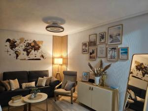 a living room with a couch and a table at Casa Dorsya - near the beach, Torrevieja, Spain in Torrevieja