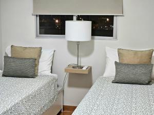 A bed or beds in a room at El ático de Concha