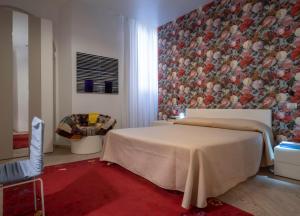 En eller flere senge i et værelse på Hotel Residenza la Ceramica